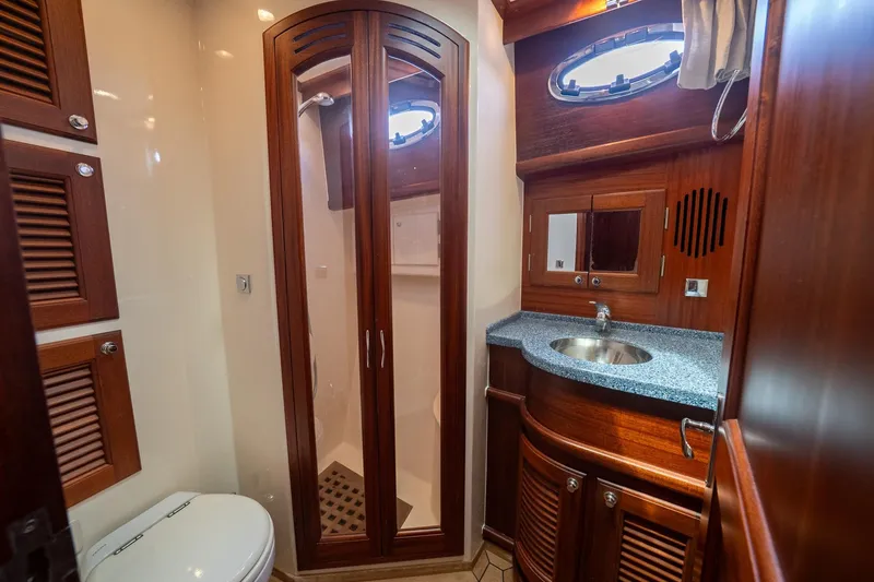 Slide: The Image of Luxurious 2007 Vicem 65 yacht bathroom with wooden cabinetry and modern fixtures. - 30