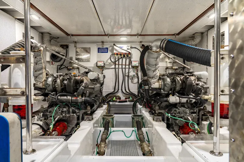 Slide: The Image of Engine room of a 2007 Vicem 65 yacht, showcasing dual engines and mechanical systems. - 31