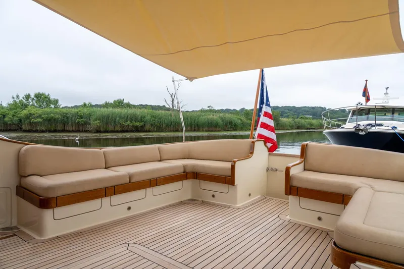 Slide: The Image of Luxurious 2007 Vicem 65 yacht deck with comfortable seating and scenic river view. - 36