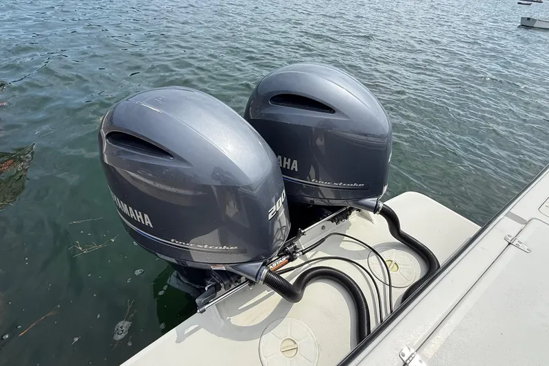 Slide: The Image of Twin Yamaha outboard engines on a 2015 Parker 2510 XLD Walkaround boat. - 19
