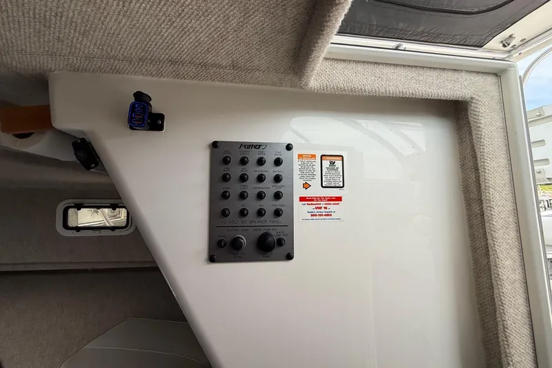 Slide: The Image of Interior view of a 2015 Parker 2510 XLD Walkaround boat's control panel. - 32