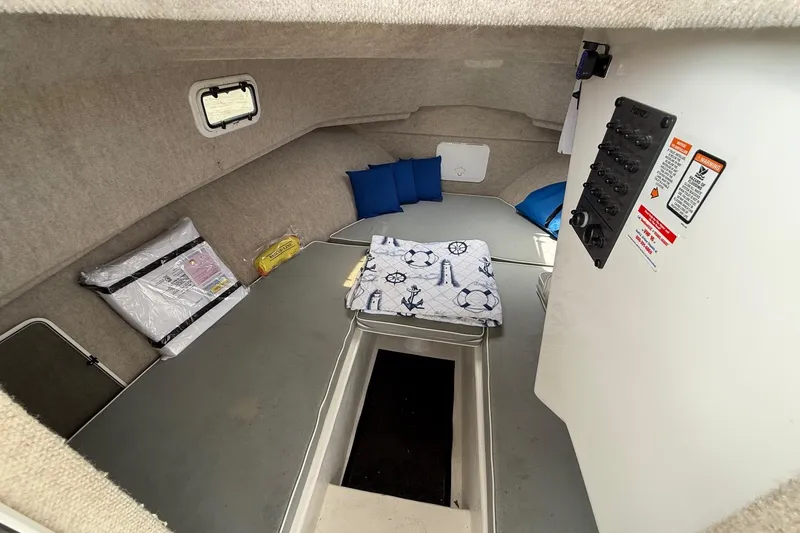 Slide: The Image of 2015 Parker 2510 XLD Walkaround cabin interior with cushions and control panel. - 38