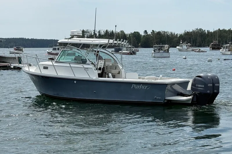Slide: The Image of 2015 Parker 2510 XLD Walkaround boat on water with Yamaha engines. - 4