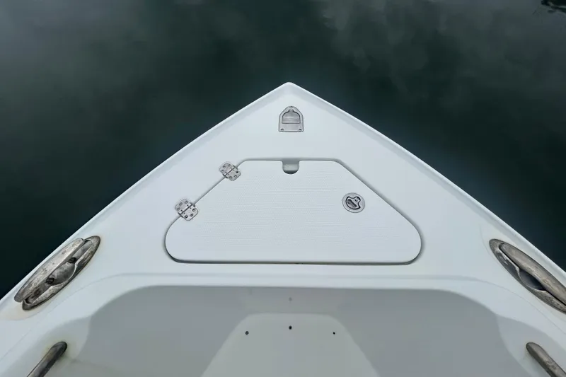 Slide: The Image of Bow of 2006 Sailfish 2660 CC boat with storage hatch and cleats. - 15