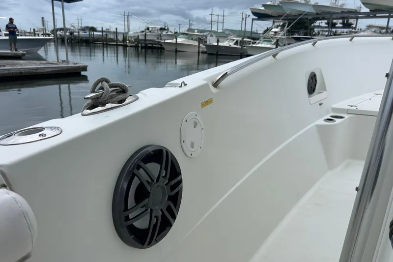Slide: The Image of 2006 Sailfish 2660 CC boat interior with speakers, docked at marina. - 18