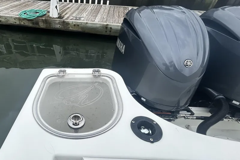 Slide: The Image of 2006 Sailfish 2660 CC boat with Yamaha outboard engines at dockside. - 33