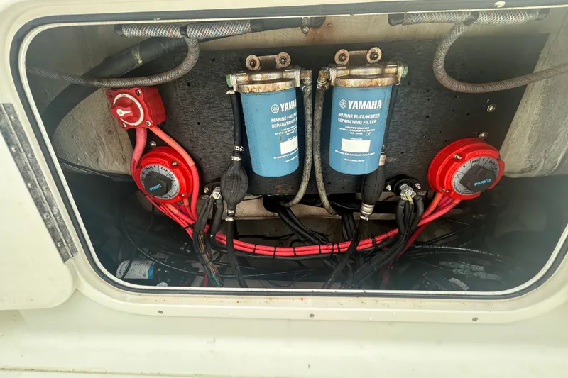 Slide: The Image of 2006 Sailfish 2660 CC boat engine compartment with Yamaha fuel filters and wiring. - 34