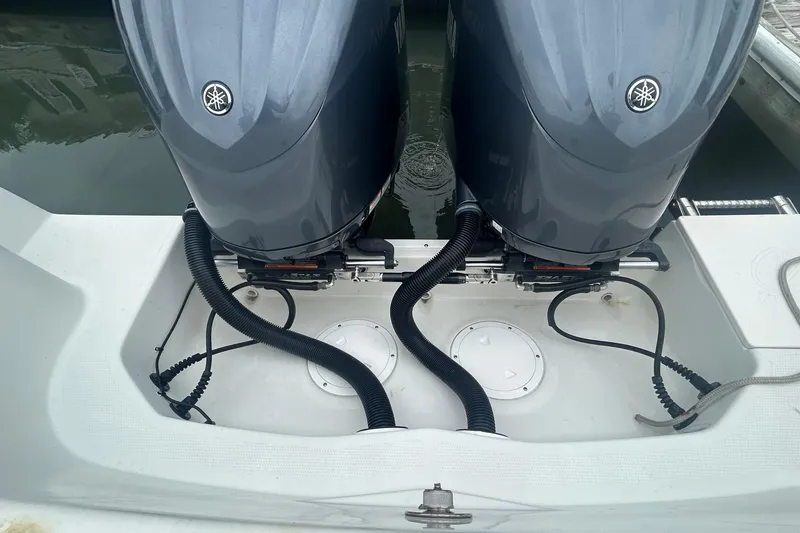 Slide: The Image of Twin Yamaha outboard engines on a 2006 Sailfish 2660 CC boat, docked. - 35