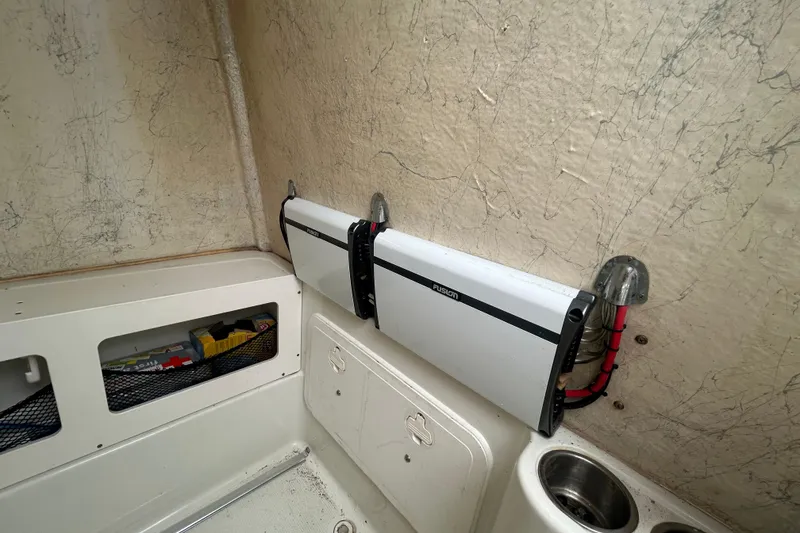 Slide: The Image of 2006 Sailfish 2660 CC boat interior with Fusion audio system installation. - 9