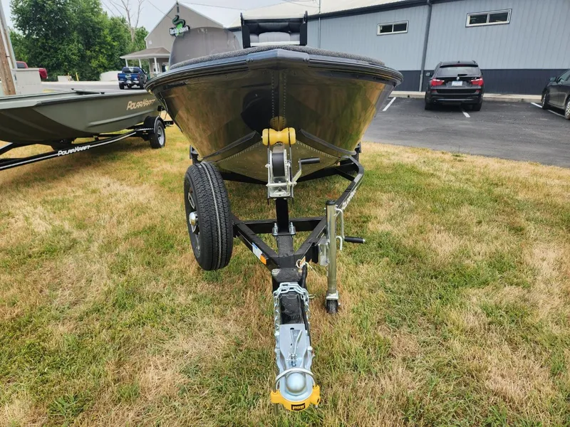 Slide: The Image of 2024 Polar Kraft Frontier 165 SCJ boat on trailer, parked on grass. - 10