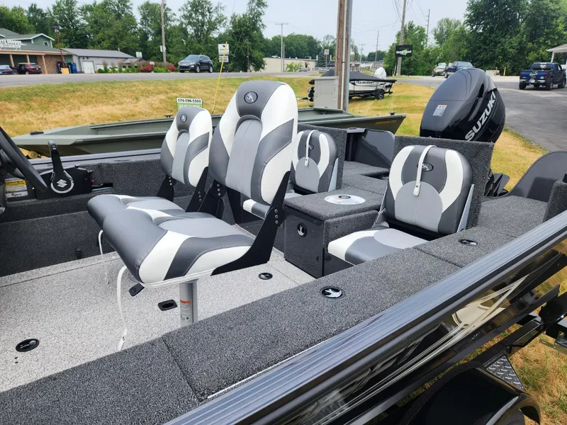 Slide: The Image of 2024 Polar Kraft Frontier 165 SCJ boat interior with gray and white seating. - 12