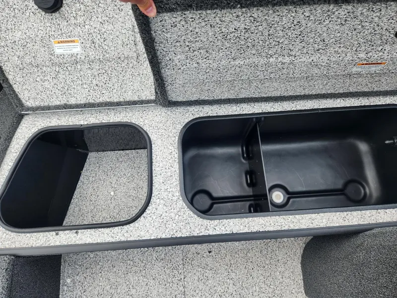Slide: The Image of 2024 Polar Kraft Frontier 165 SCJ boat storage compartments, featuring durable interior design. - 16