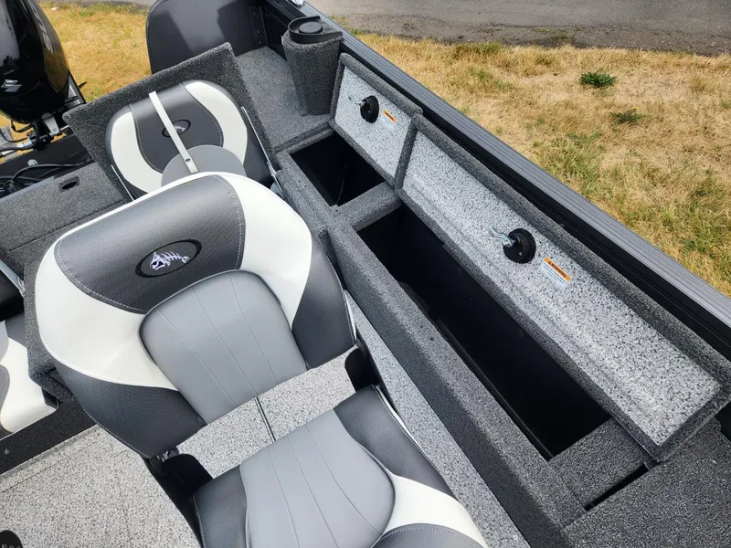 Slide: The Image of 2024 Polar Kraft Frontier 165 SCJ boat interior with gray seating and storage compartments. - 19