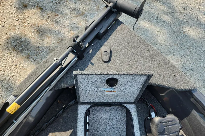 Slide: The Image of 2024 Polar Kraft Frontier 165 SCJ boat deck with storage compartment and trolling motor. - 24