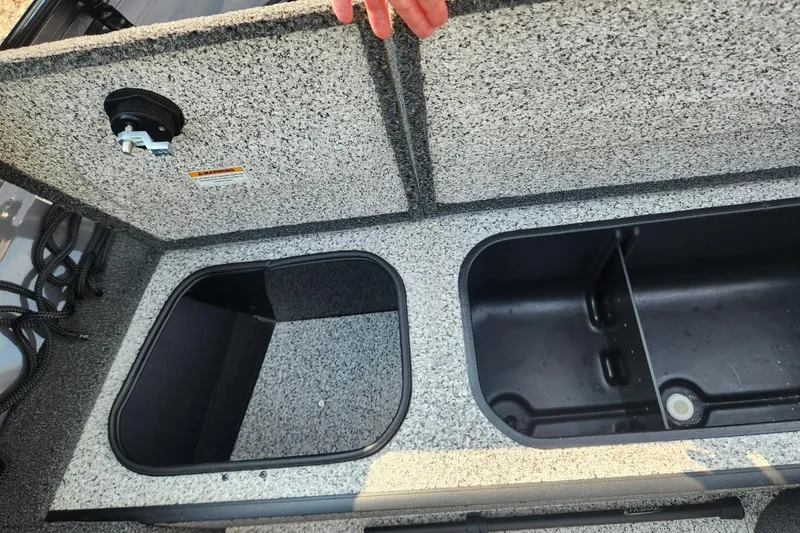Slide: The Image of 2024 Polar Kraft Frontier 165 SCJ boat storage compartments, open and empty. - 27