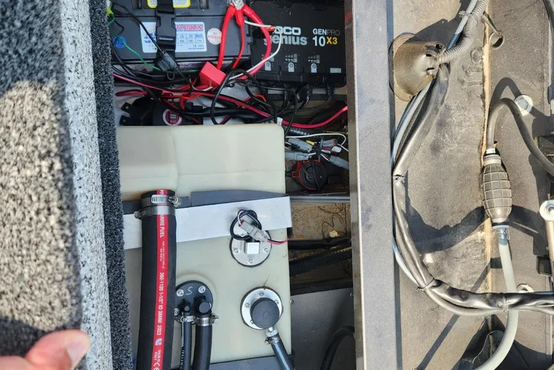 Slide: The Image of 2024 Polar Kraft Frontier 165 SCJ boat interior showing battery and wiring components. - 29