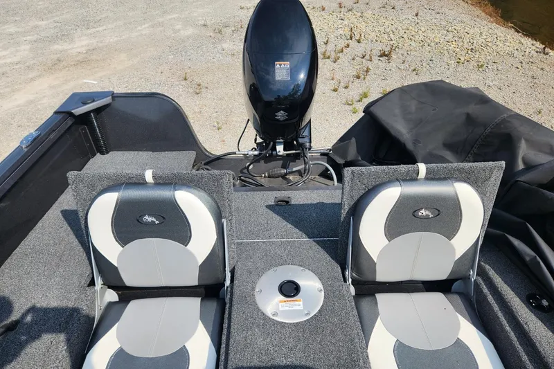 Slide: The Image of 2024 Polar Kraft Frontier 165 SCJ boat interior with dual seats and motor. - 31