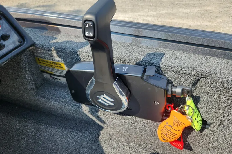 Slide: The Image of 2024 Polar Kraft Frontier 165 SCJ boat throttle control with key fobs attached. - 35