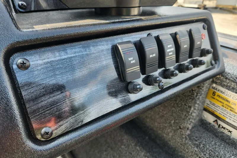 Slide: The Image of 2024 Polar Kraft Frontier 165 SCJ control panel with switches for navigation and bilge. - 36