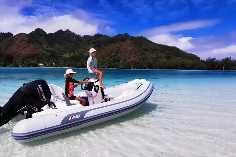 Slide: The Image of 2026 AB Inflatables Oceanus 15 VST in tropical waters, with scenic mountain backdrop. - 10