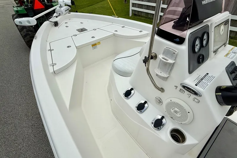 Slide: The Image of 2013 NauticStar 1910 NauticBay boat interior with control panel and seating. - 12