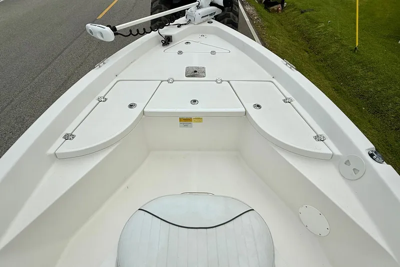 Slide: The Image of 2013 NauticStar 1910 NauticBay boat interior with storage compartments and seating. - 13