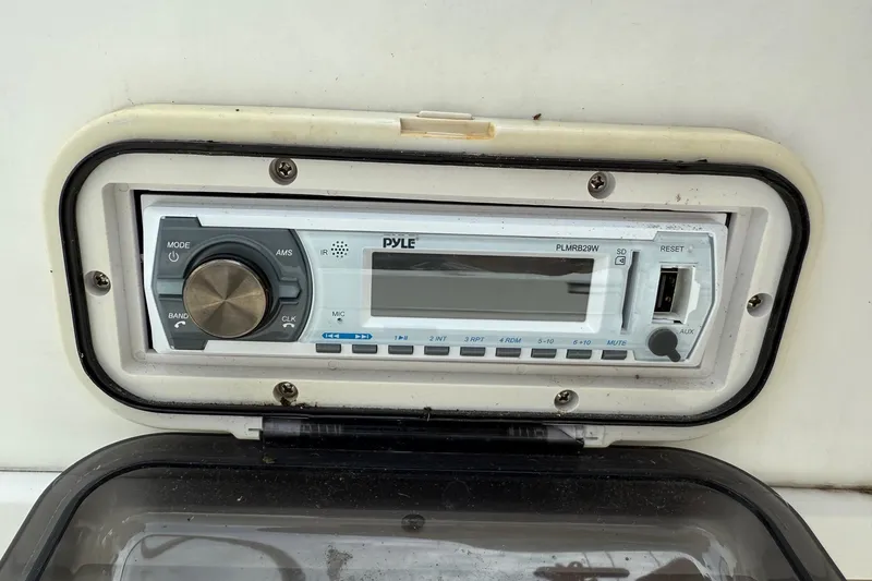 Slide: The Image of Pyle marine stereo system on 2013 NauticStar 1910 NauticBay boat dashboard. - 17