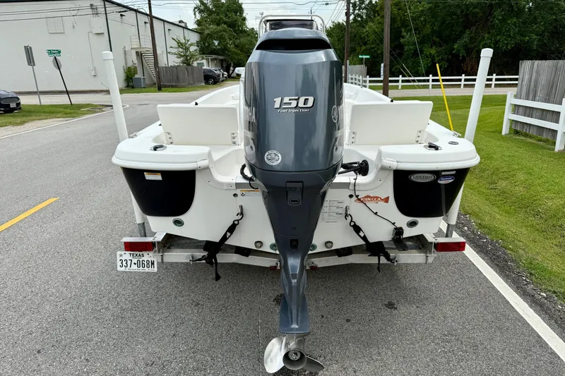 Slide: The Image of 2013 NauticStar 1910 NauticBay boat with Yamaha 150 engine on a trailer. - 3