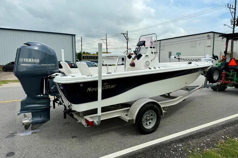 Slide: The Image of 2013 NauticStar 1910 NauticBay boat on trailer with Yamaha outboard motor. - 4