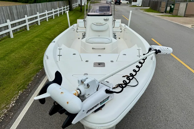 Slide: The Image of 2013 NauticStar 1910 NauticBay boat with trolling motor on a paved road. - 6