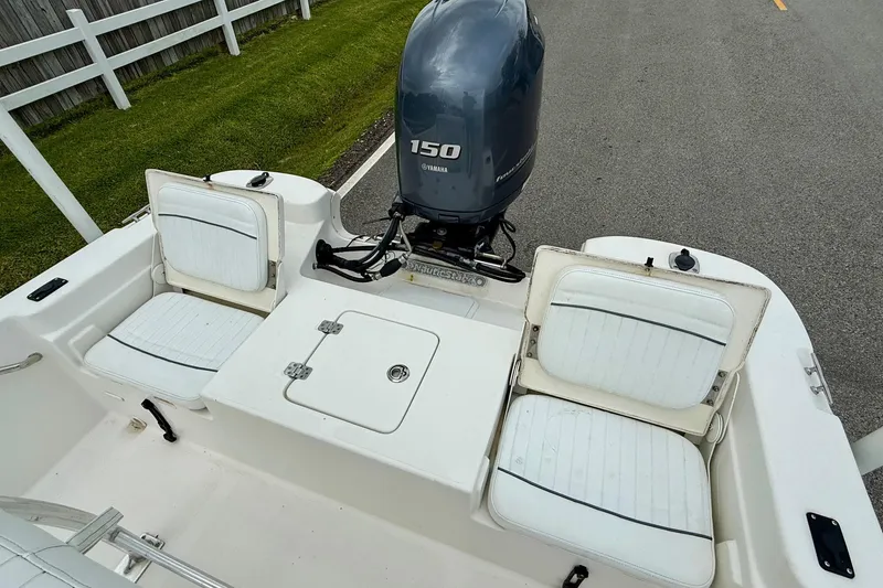 Slide: The Image of 2013 NauticStar 1910 NauticBay boat with Yamaha 150 engine and white seating. - 7