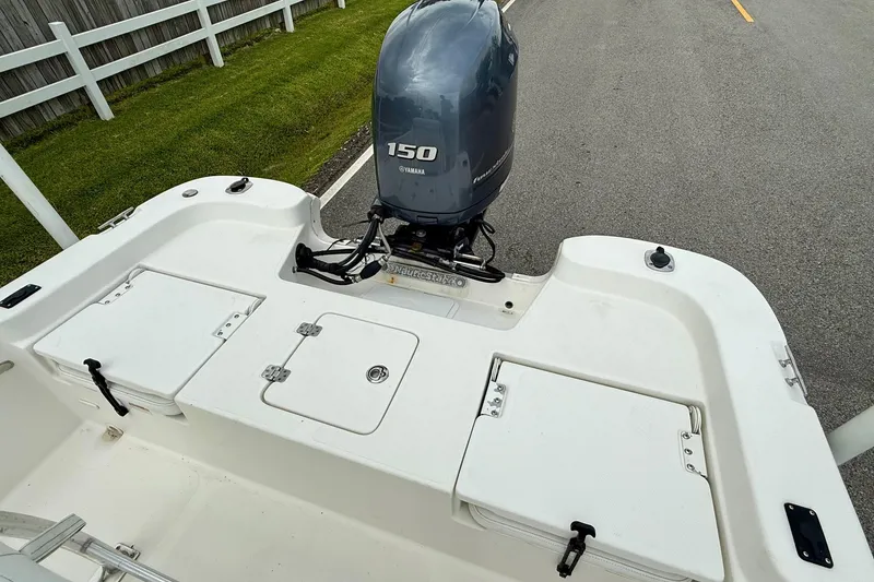 Slide: The Image of 2013 NauticStar 1910 NauticBay boat with Yamaha 150 engine, rear deck view. - 8