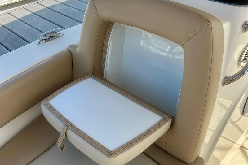 Slide: The Image of 2023 Scout 195 Sport Dorado boat seat with beige and white upholstery. - 7