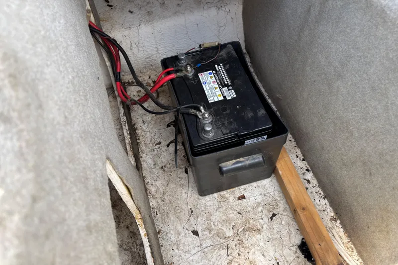 Slide: The Image of Battery compartment of a 1995 Bayliner Maxum boat with visible wiring. - 14