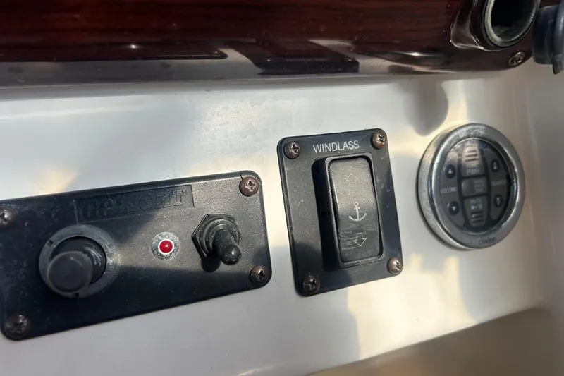 Slide: The Image of Control panel of a 2001 Larson Cabrio 330 boat with windlass switch. - 10