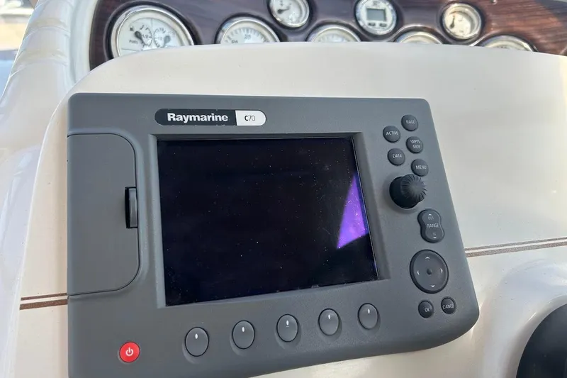 Slide: The Image of Raymarine C70 navigation system on 2001 Larson Cabrio 330 boat dashboard. - 11