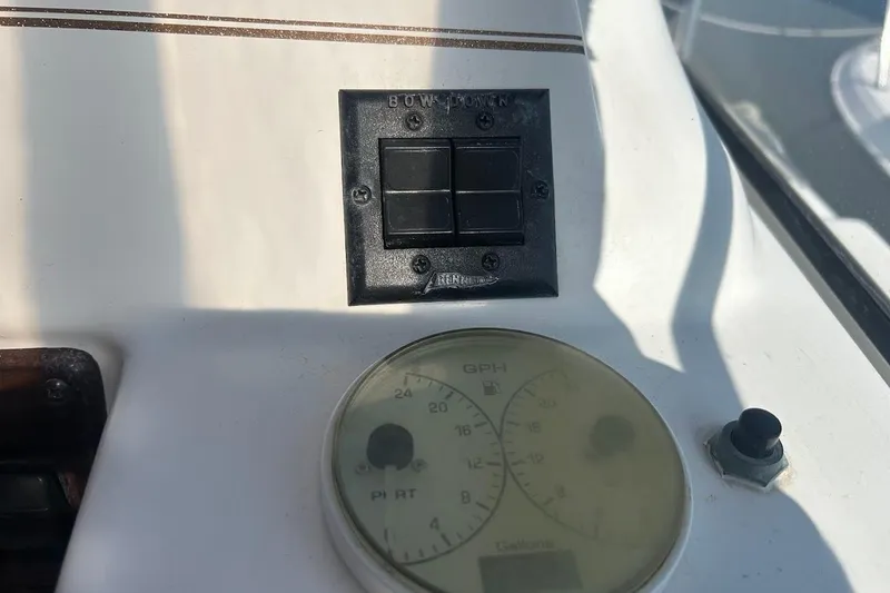 Slide: The Image of Control panel of a 2001 Larson Cabrio 330 boat with gauges and switches. - 9