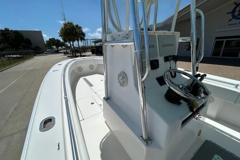 Slide: The Image of 2018 Contender 28 Tournament boat with Garmin electronics, docked under clear skies. - 10