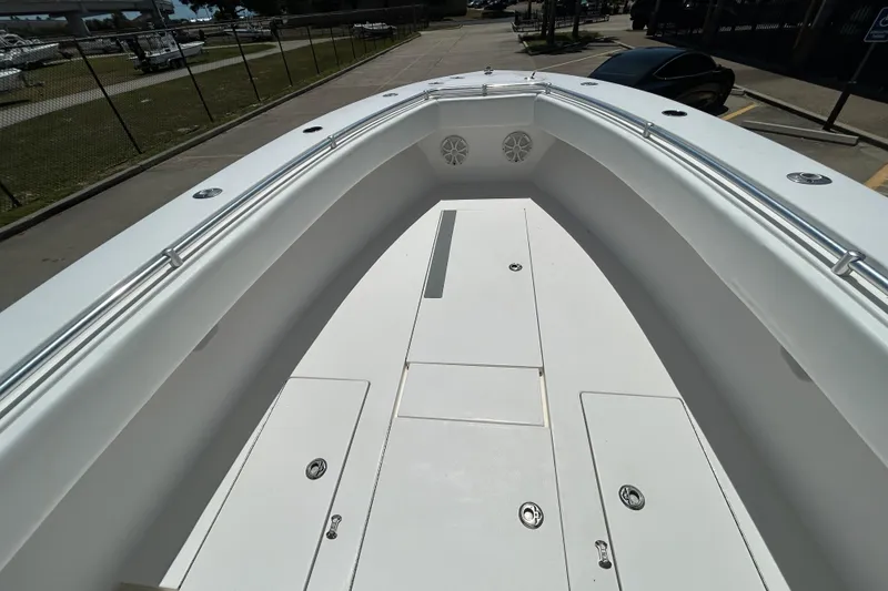 Slide: The Image of 2018 Contender 28 Tournament boat deck with storage compartments and railings. - 13