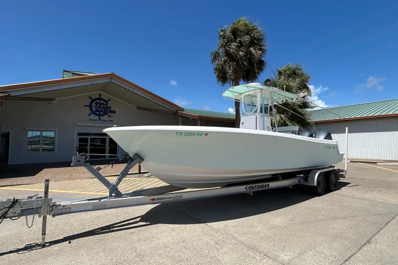 Slide: The Image of 2018 Contender 28 Tournament boat on trailer outside Gulf Coast Marine building. - 5