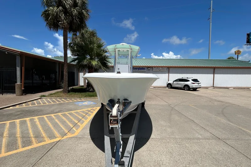 Slide: The Image of 2018 Contender 28 Tournament boat on trailer in parking lot, sunny day. - 6