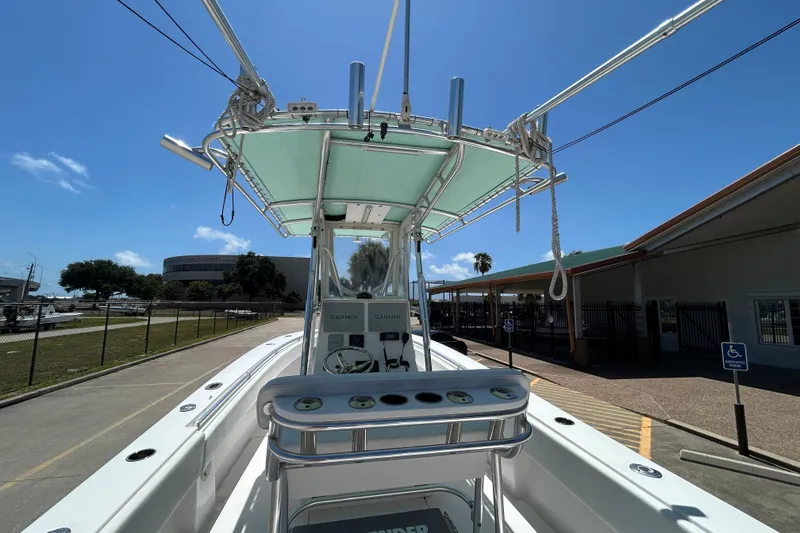 Slide: The Image of 2018 Contender 28 Tournament boat with Garmin electronics, docked under clear blue sky. - 8