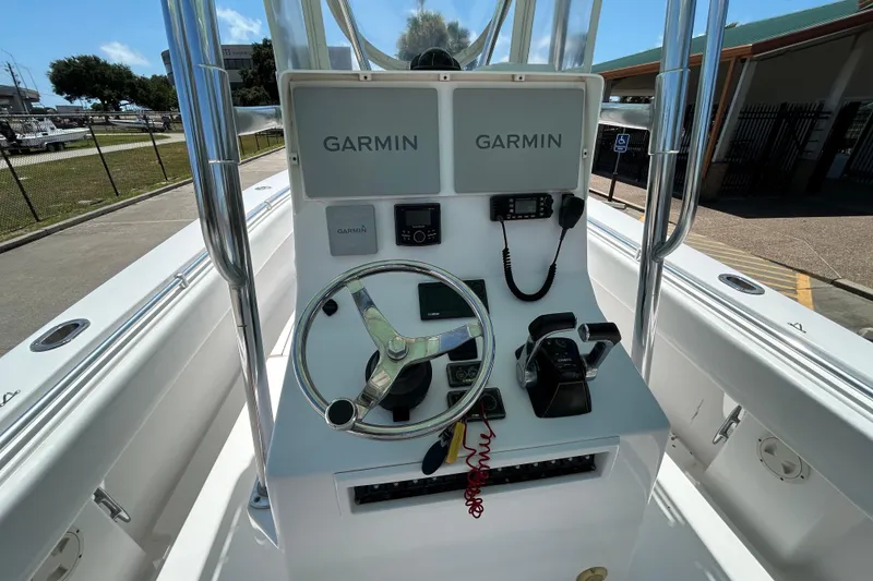 Slide: The Image of 2018 Contender 28 Tournament boat console with Garmin electronics and steering wheel. - 9