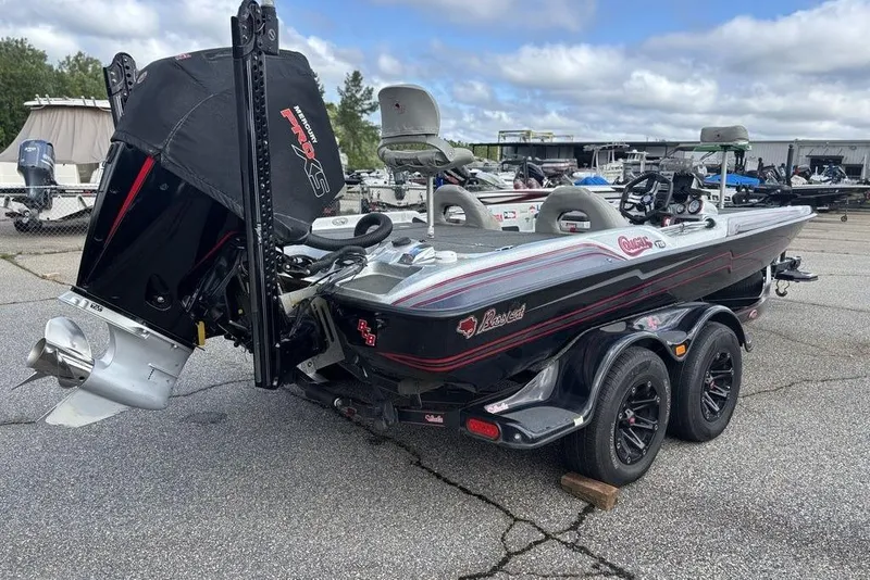 Slide: The Image of 2020 Bass Cat Cougar FTD boat on trailer, featuring dual seats and powerful outboard motor. - 10