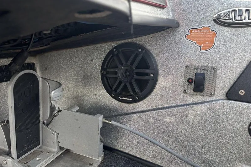 Slide: The Image of 2020 Bass Cat Cougar FTD interior with speaker, control panel, and foot pedal. - 13