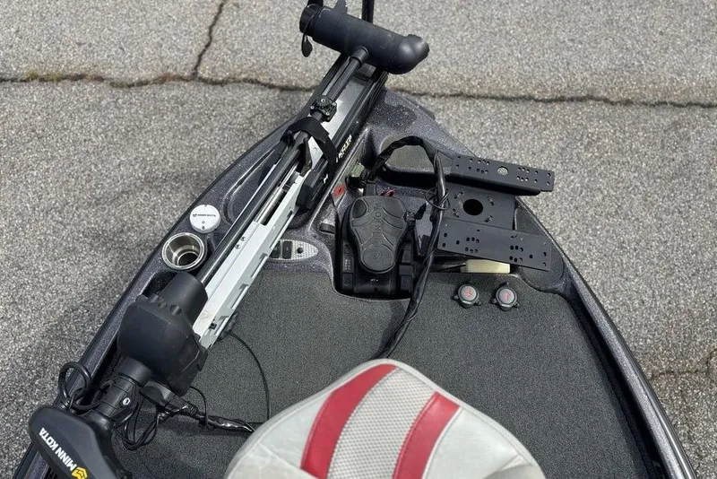 Slide: The Image of 2020 Bass Cat Cougar FTD boat deck with trolling motor and control panel. - 14