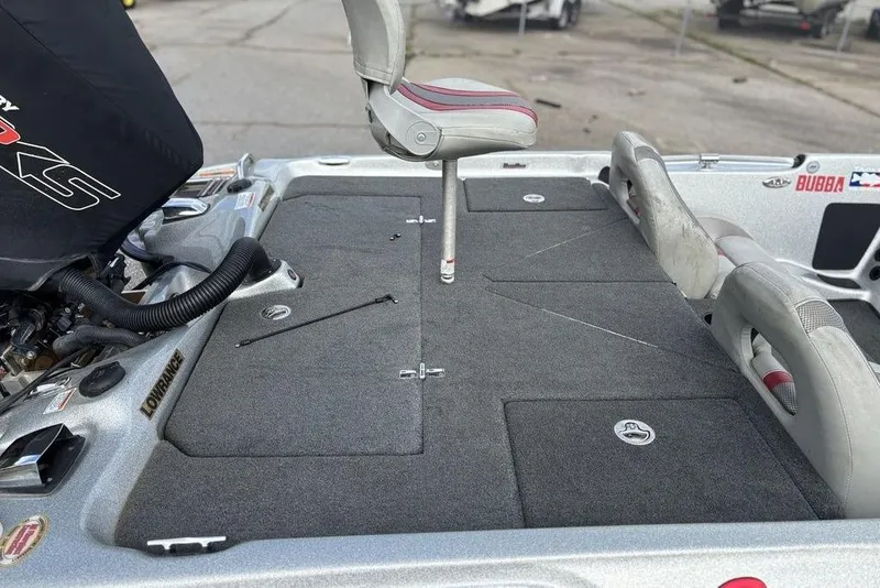 Slide: The Image of 2020 Bass Cat Cougar FTD boat deck with seating and storage compartments. - 17