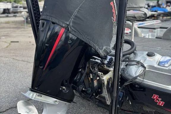 Slide: The Image of 2020 Bass Cat Cougar FTD boat engine close-up with protective cover. - 4