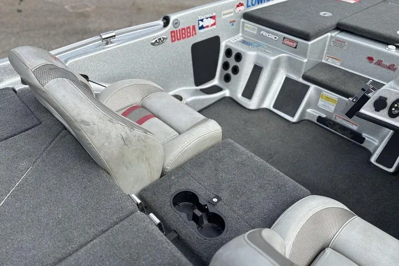 Slide: The Image of 2020 Bass Cat Cougar FTD boat interior with gray seating and control panel. - 5