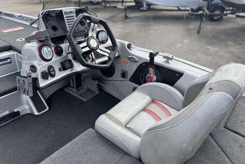 Slide: The Image of 2020 Bass Cat Cougar FTD boat cockpit with steering wheel and gauges. - 7